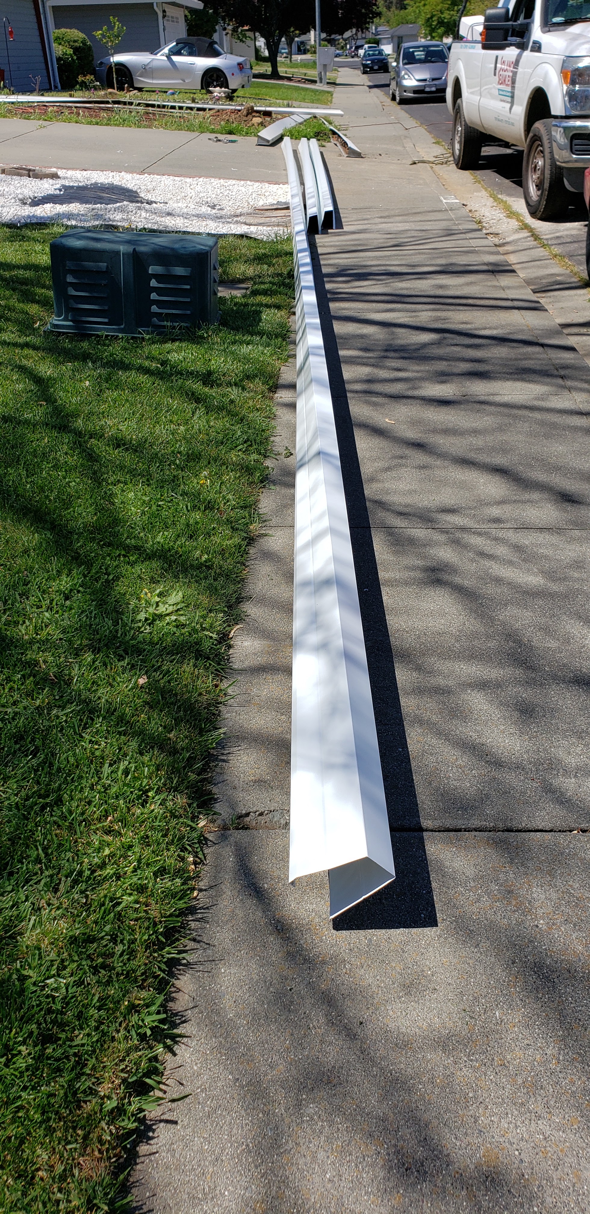 Freshly fabricated seamless gutter sections laid out ready for installation by Solano Seamless